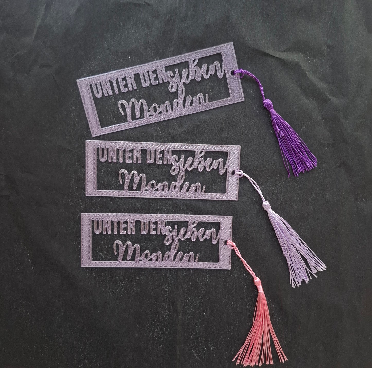 Lesezeichen "Unter den sieben Monden"