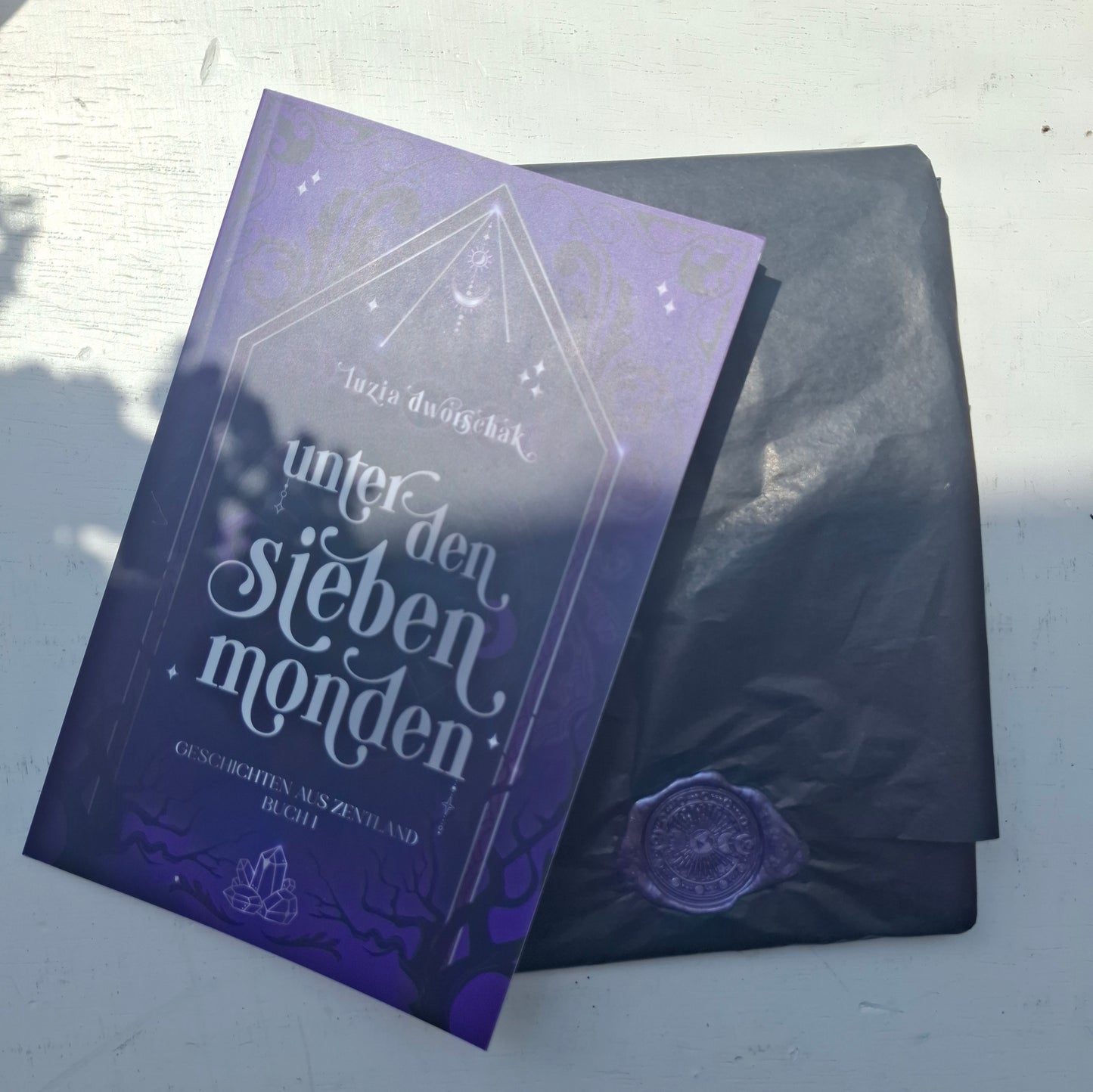 Taschenbuch "Unter den sieben Monden: Geschichten aus Zentland"
